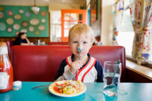Boy with spoon on nose