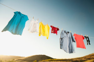 USA, California, Ladera Ranch, Laundry hanging on clothesline against blue sky