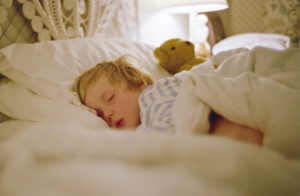 UNITED KINGDOM - FEBRUARY 26: Young boy sleeping in a hotel bed, Devon, England (Photo by Tim Graham/Getty Images)