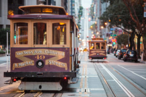 Cable cars on city street, San Francisco, California, USA