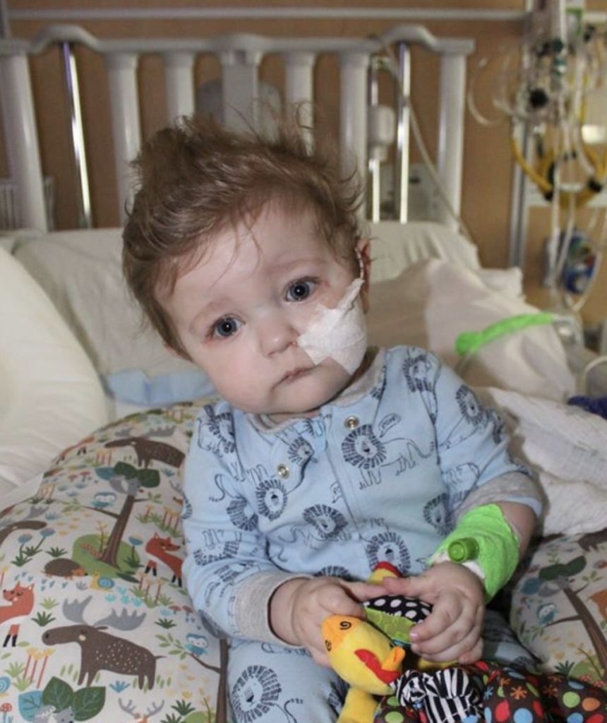 sick child in hospital receives a gift from the Little Wishes organization
