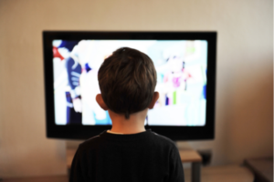 toddler watching television for his allotted screen time of the day