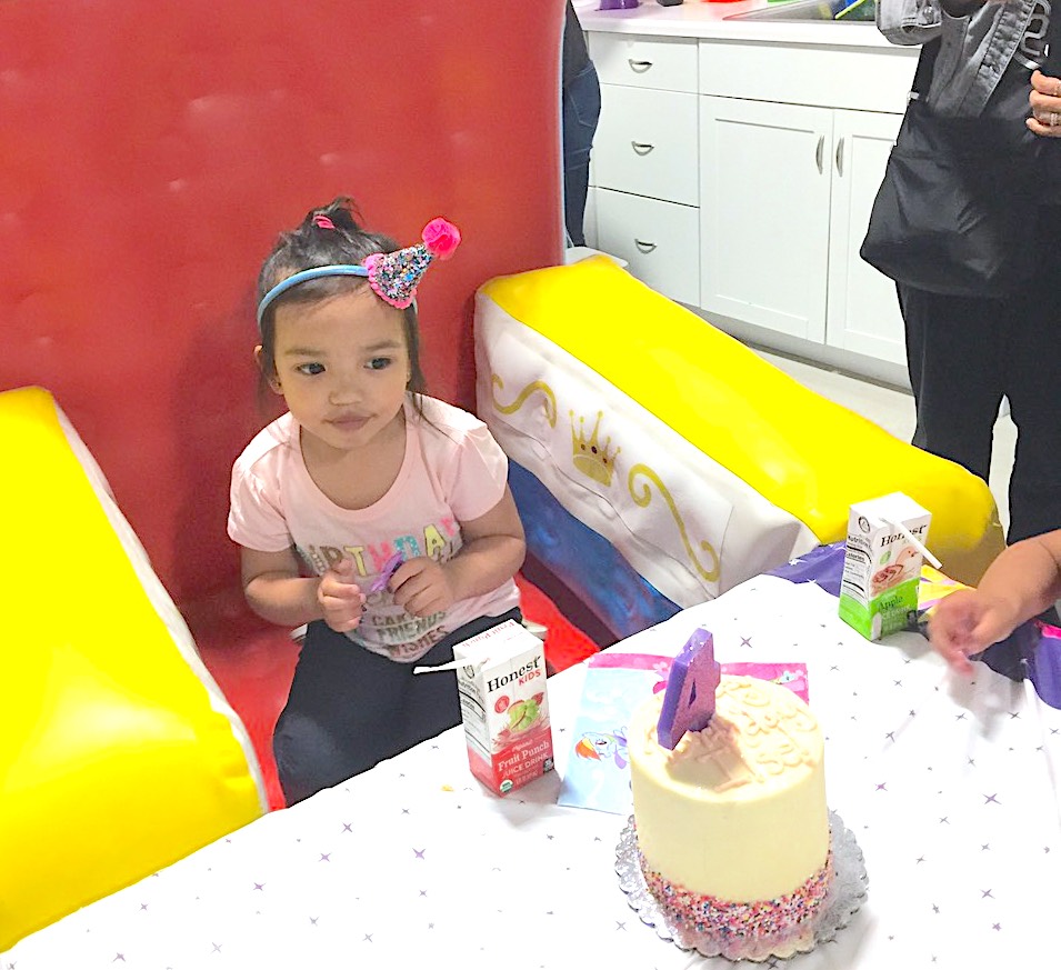 little girl turning four celebrating her birthday party a Peek-a-Boo Factory, local indoor playspace