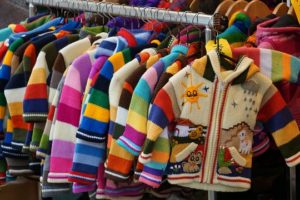 clothing rack of children's cardigans