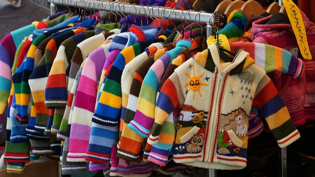 clothing rack of children's cardigans