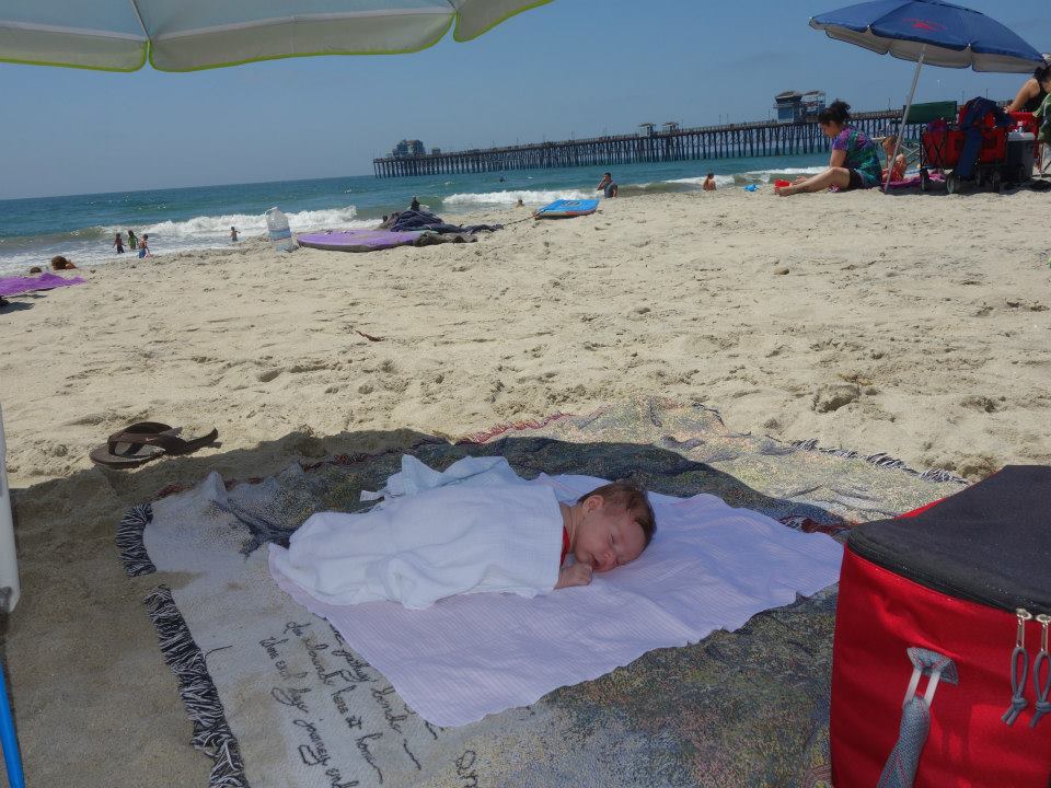 newborn anna sleeping at the beach